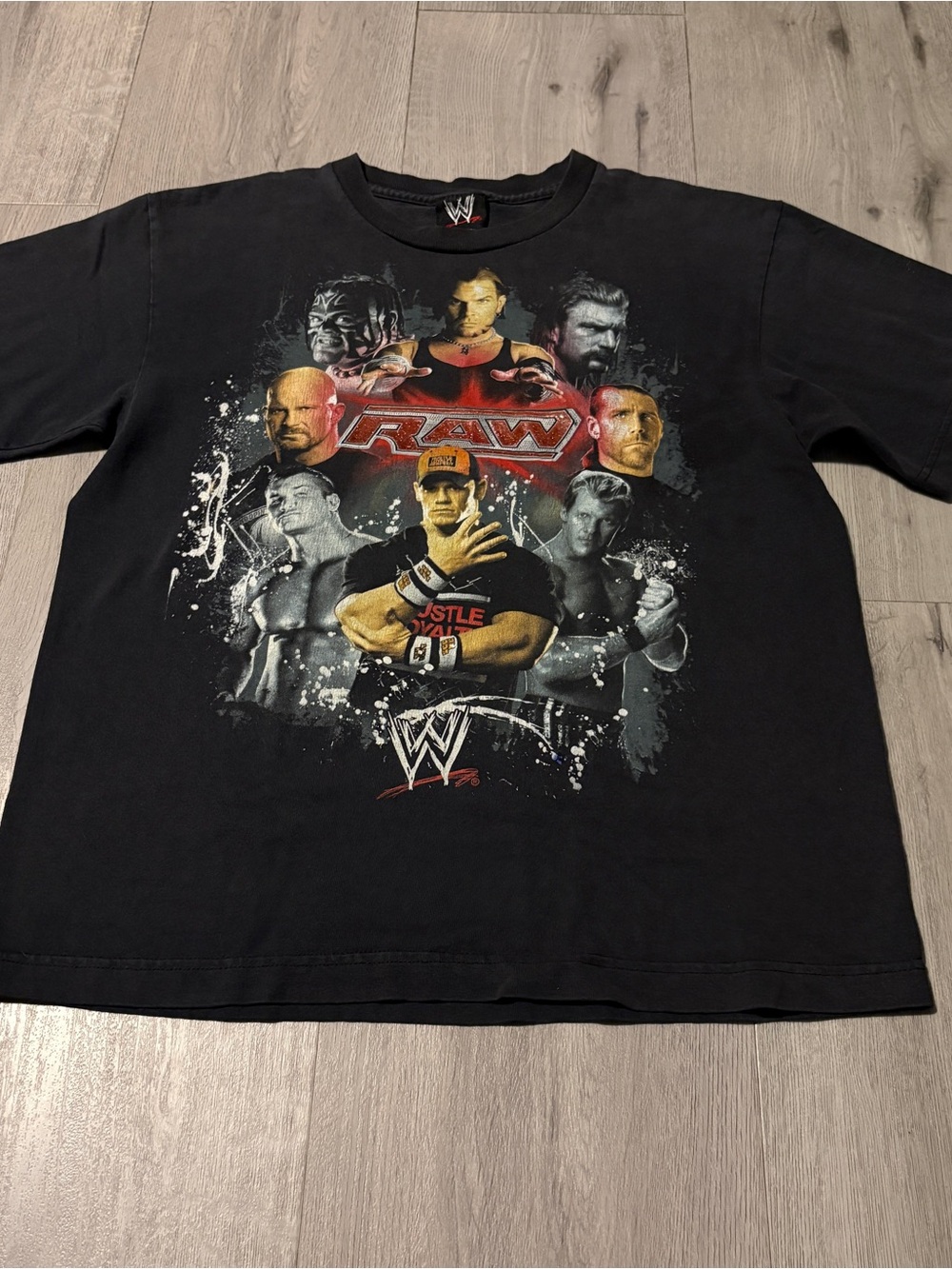 WWE Black RAW Graphic Tee with Multi-Color Superstar Collage